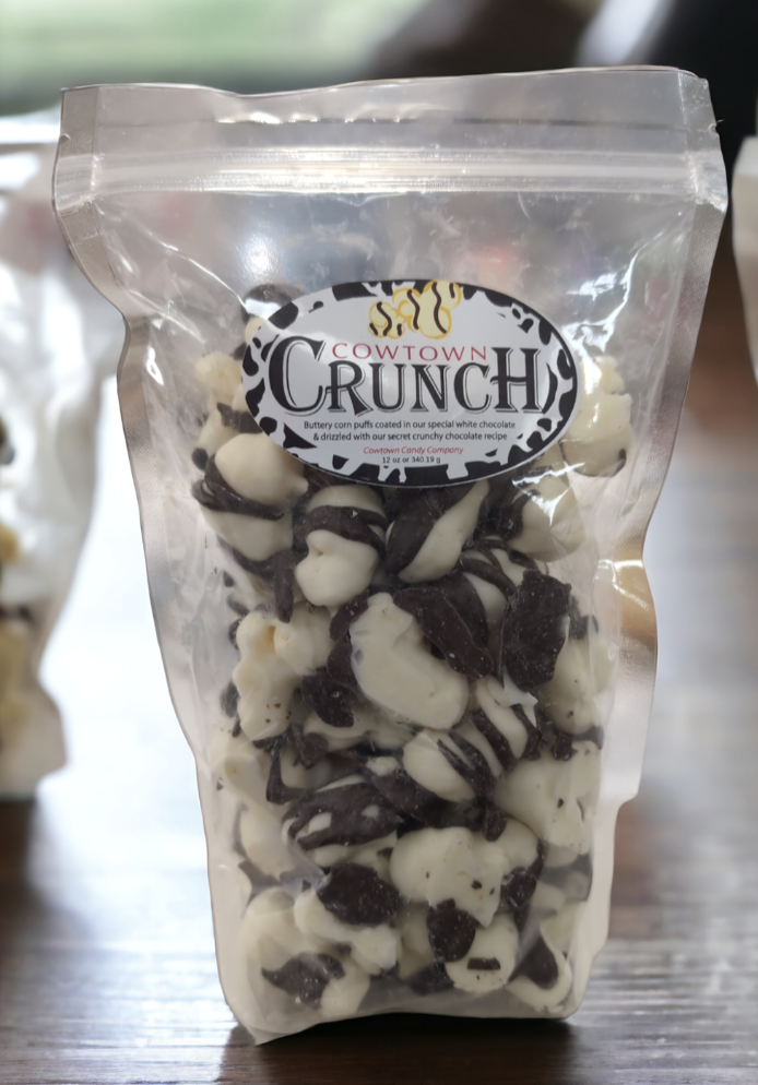 Bag of Cowtown Crunch snack mix with visible branding on a wooden surface.