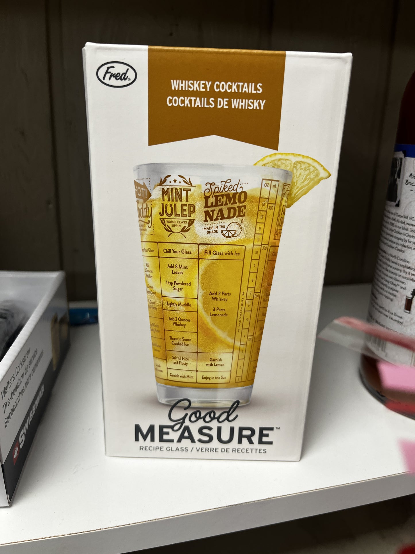 Good Measure recipe glass packaging with a cocktail illustration on a white surface.