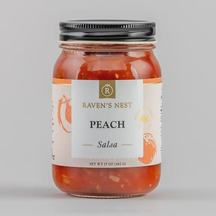 Jar of Raven's Nest Peach Salsa on a gray background