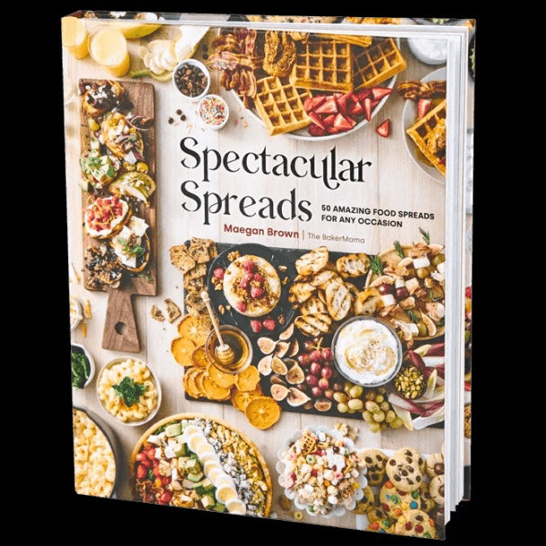 Book titled 'Spectacular Spreads' with food images on the cover