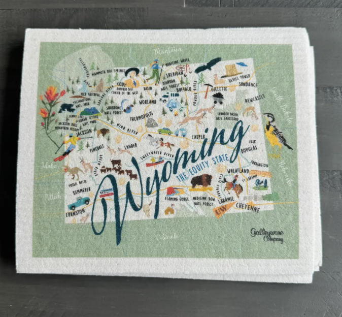 Framed map of Wyoming with various symbols on a green background