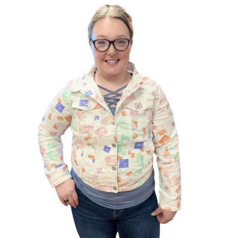 Person wearing a patterned jacket on a white background