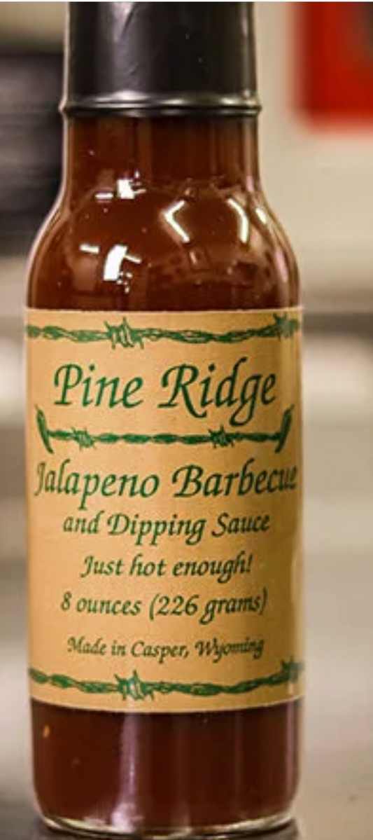 Bottle of Pine Ridge Jalapeno Barbecue and Dipping Sauce on a blurred background