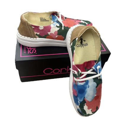 Floral-patterned shoes with a box on a white background
