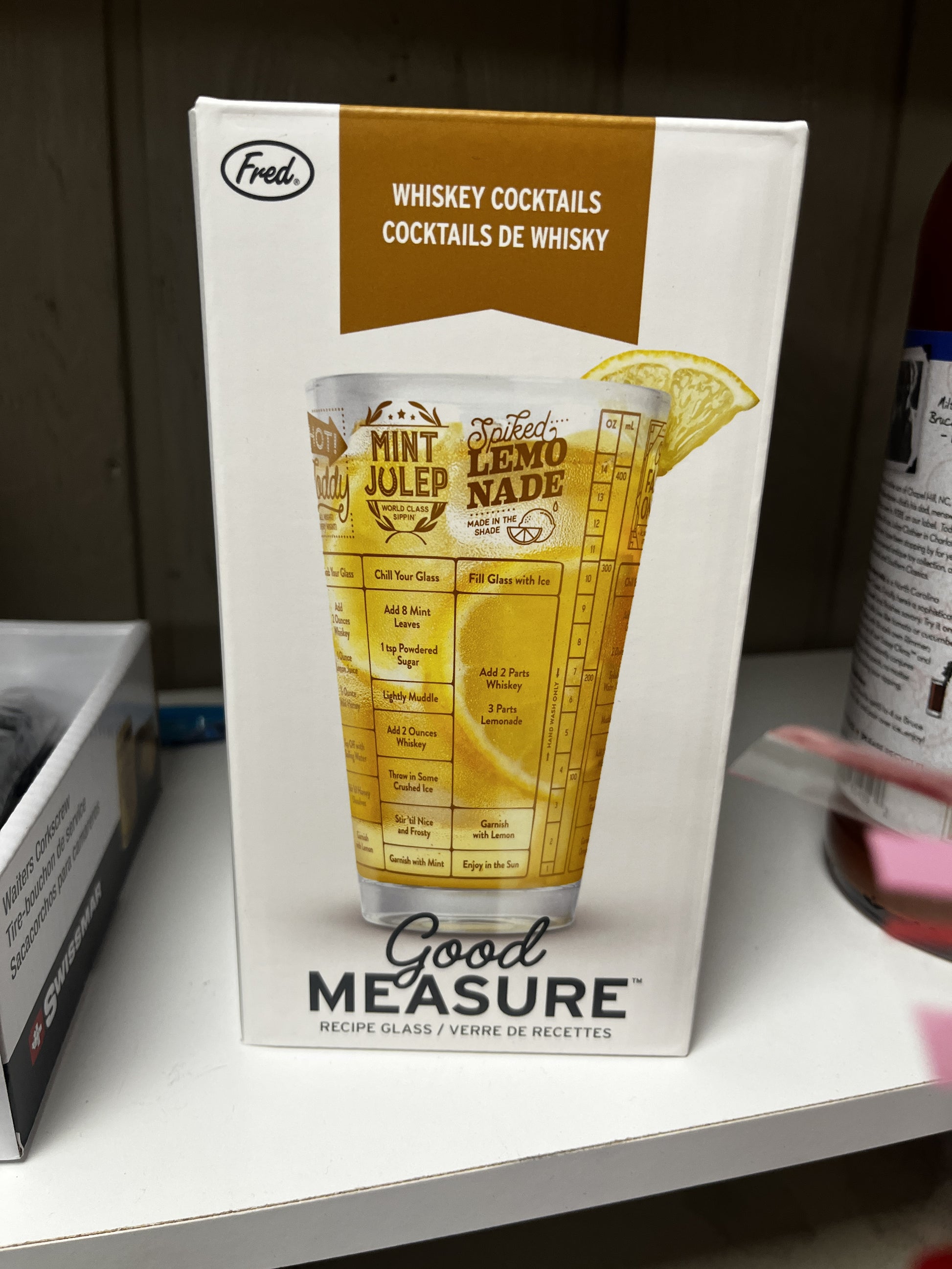 Good Measure recipe glass packaging with a cocktail illustration on a white surface.