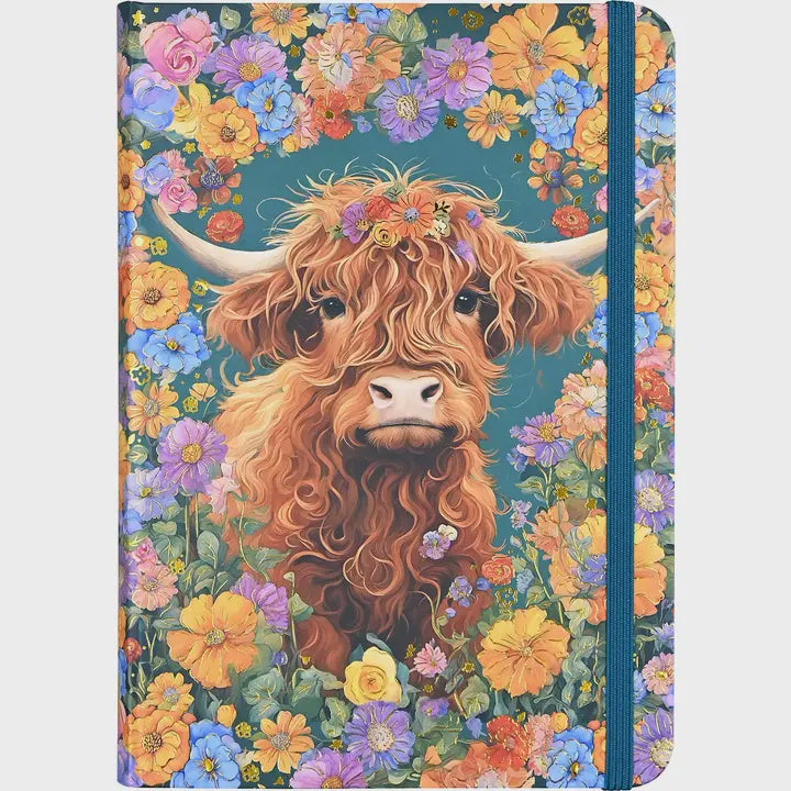 Notebook with a highland cow illustration surrounded by colorful flowers on a teal background