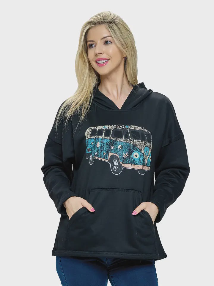 Woman wearing a black hoodie with a blue graphic design on a white background