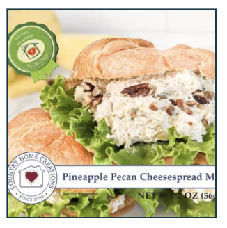 Pineapple Pecan Cheesespread on a bun with lettuce, featuring Country Home Creations branding.