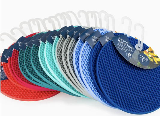 Row of silicone round travel mats in various colors with brand labels.