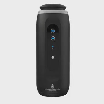 Black air purifier with blue indicator lights on a light gray background