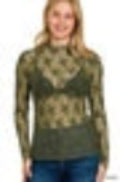 Woman wearing a patterned sweater with a blurred background